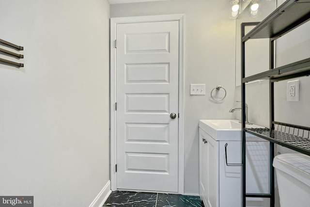 bathroom with vanity and toilet