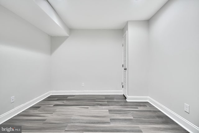 basement featuring dark wood-type flooring