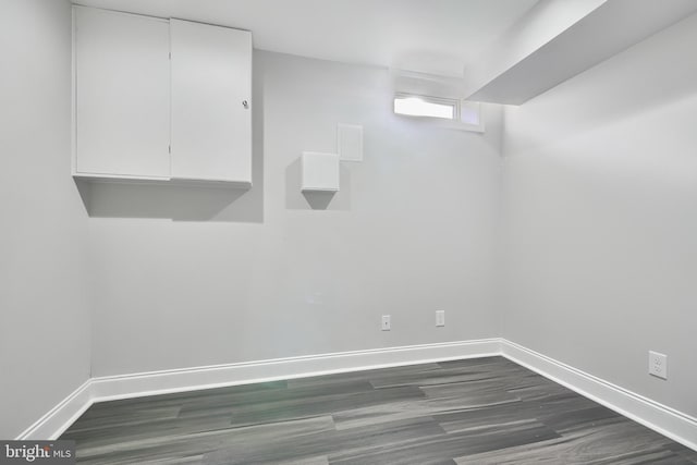 basement featuring dark wood-type flooring