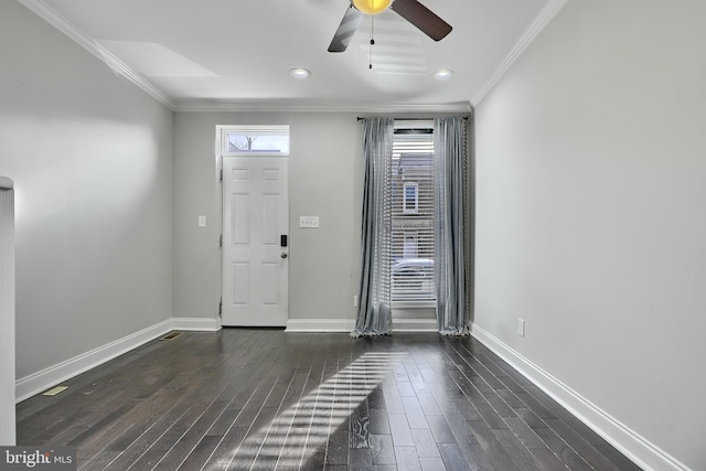 foyer featuring dark hardwood / wood-style floors, ceiling fan, and crown molding