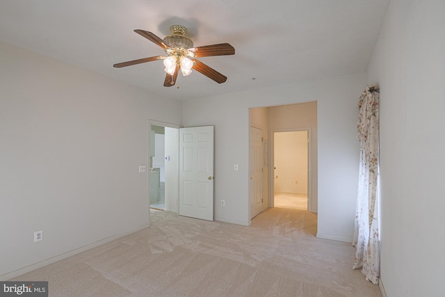 unfurnished bedroom with light colored carpet and ceiling fan