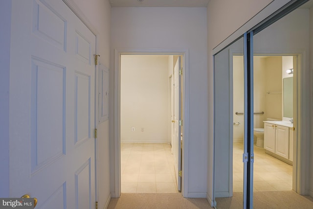 hallway with light carpet