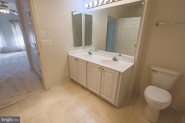 bathroom with ceiling fan, toilet, and vanity