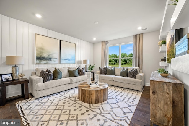 living room with dark hardwood / wood-style flooring