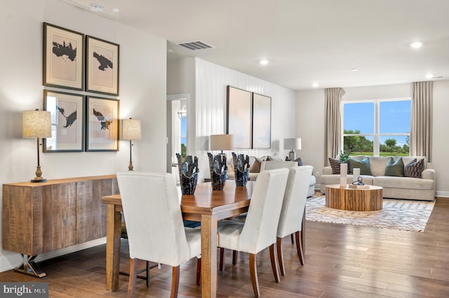 dining area featuring dark wood-type flooring