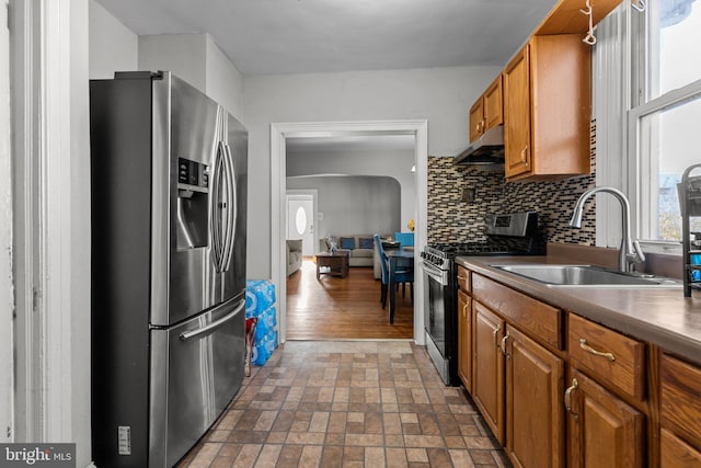 kitchen with decorative backsplash, stainless steel appliances, dark hardwood / wood-style floors, and sink