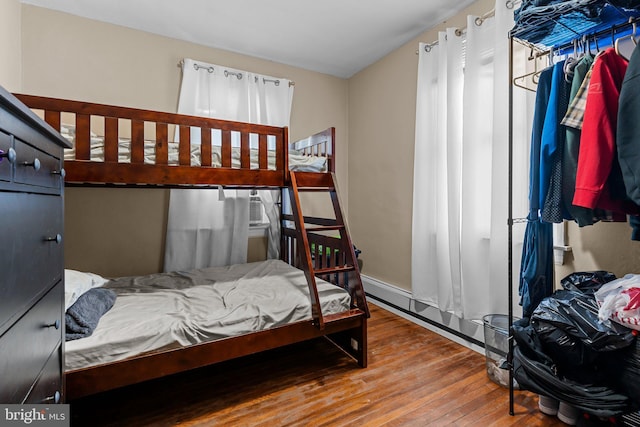 bedroom featuring wood-type flooring