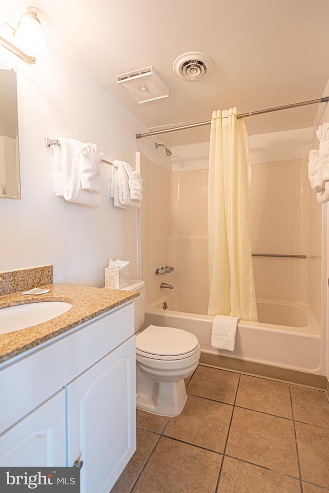 full bathroom featuring toilet, shower / bath combination with curtain, vanity, and tile patterned floors