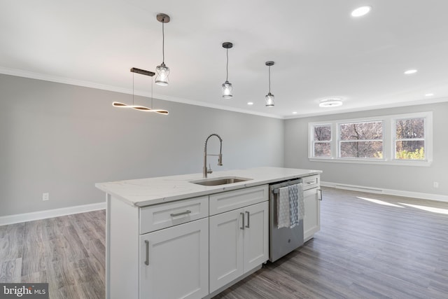 kitchen with sink, hanging light fixtures, stainless steel dishwasher, light hardwood / wood-style floors, and white cabinetry