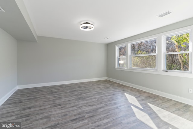 unfurnished room featuring wood-type flooring