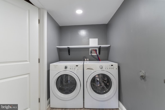 laundry area featuring washing machine and clothes dryer