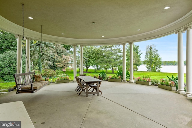 view of patio with a water view