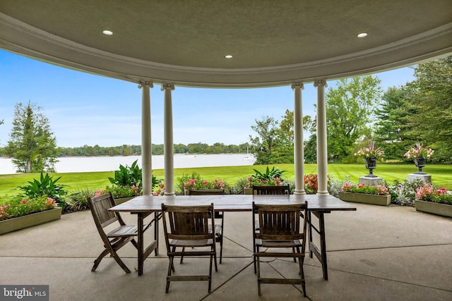 view of patio featuring a water view