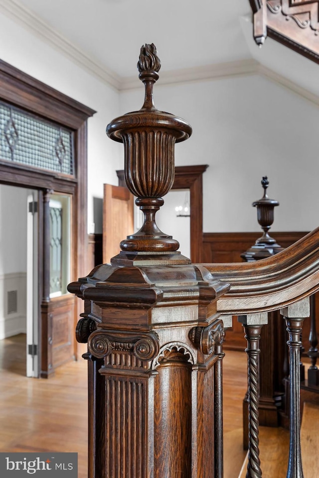 details featuring wood-type flooring and ornamental molding