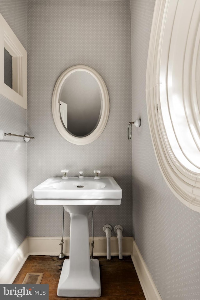 bathroom with hardwood / wood-style flooring