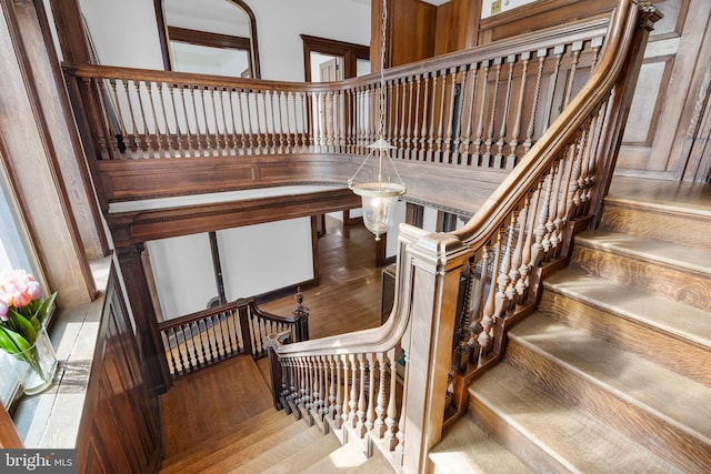 stairway featuring wood-type flooring