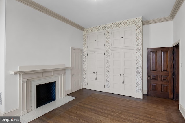 unfurnished living room featuring dark hardwood / wood-style flooring and ornamental molding