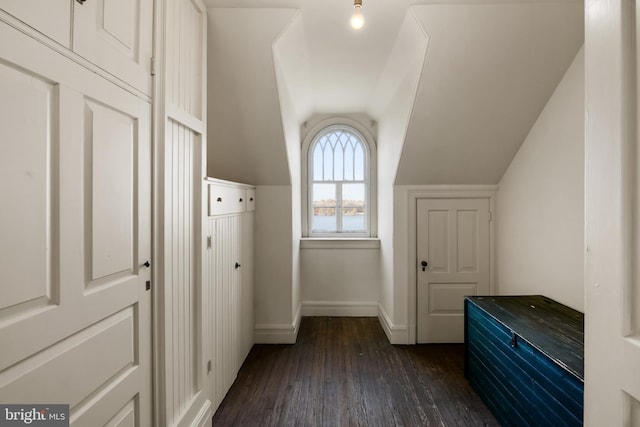 mudroom with dark hardwood / wood-style flooring and vaulted ceiling