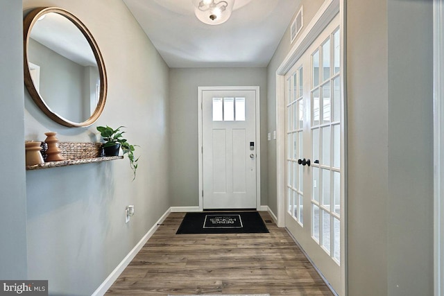 interior space featuring wood-type flooring and french doors