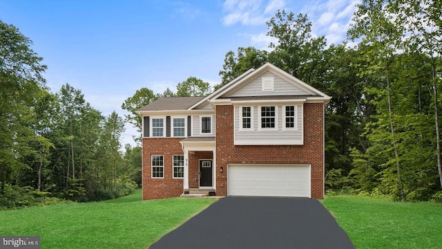 805 Long Meadow Dr, Fredericksburg, VA 22406 - view of front of home with driveway, an attached garage, brick siding, and a front yard