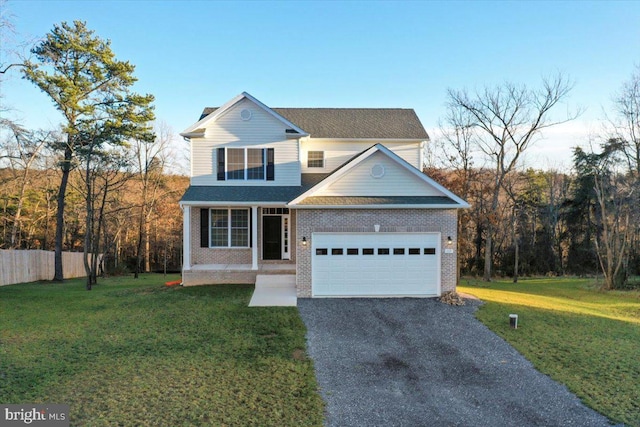 view of front property with a garage, a porch, and a front yard