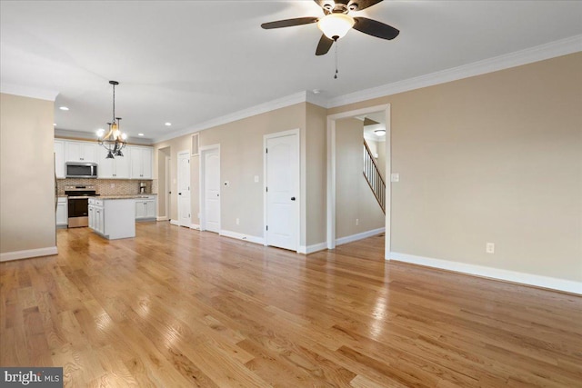 unfurnished living room with ceiling fan with notable chandelier, ornamental molding, and light wood-type flooring