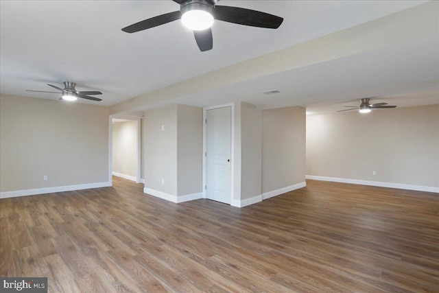 spare room with ceiling fan and wood-type flooring