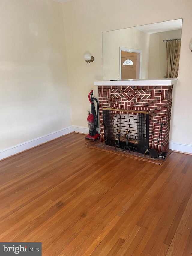 unfurnished living room with hardwood / wood-style floors