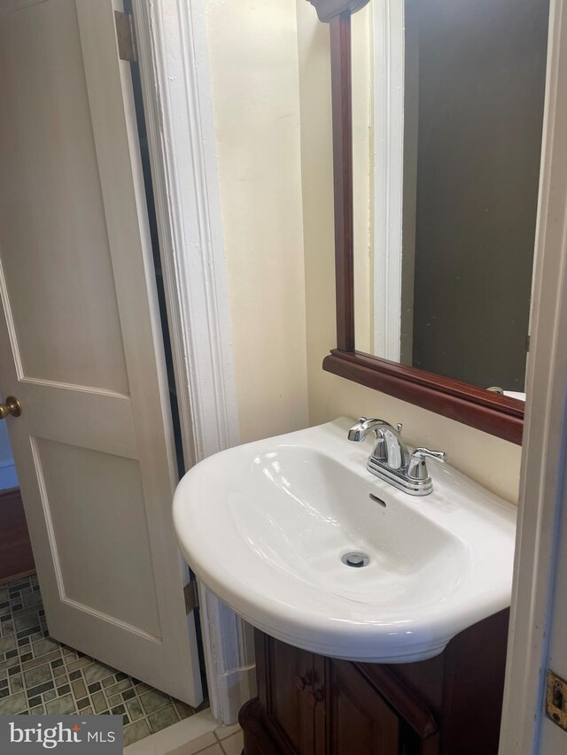 bathroom with tile patterned floors and sink