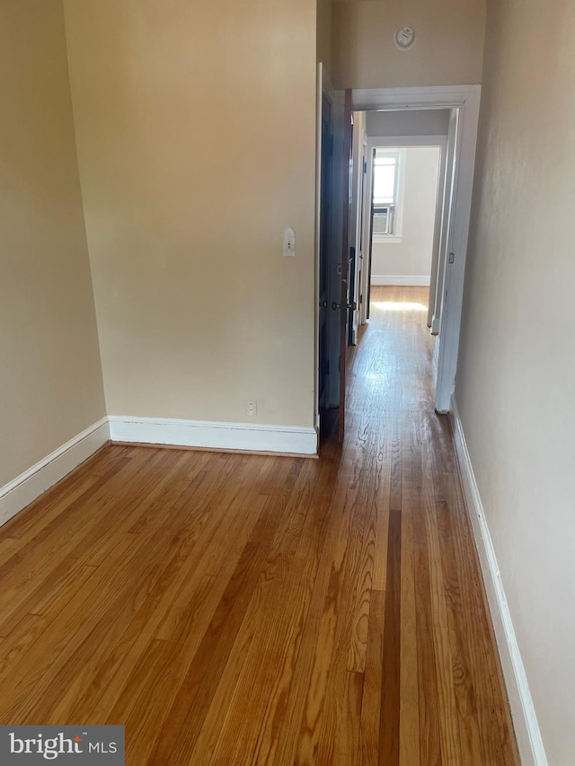 hallway with light wood-type flooring