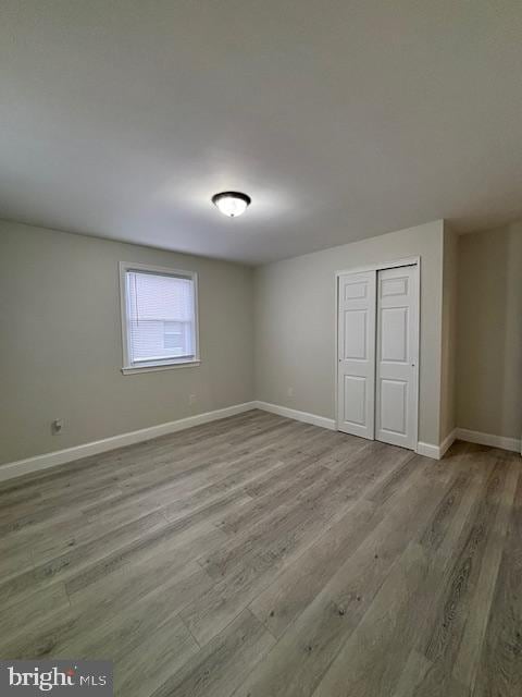 spare room featuring light hardwood / wood-style floors