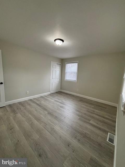 unfurnished bedroom featuring hardwood / wood-style floors