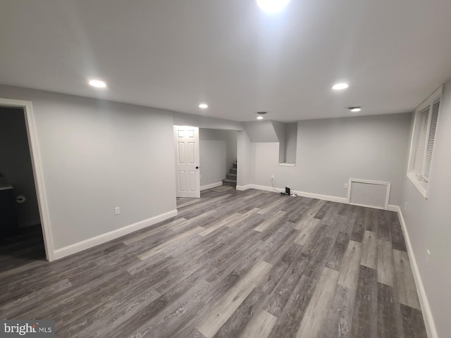 basement featuring dark hardwood / wood-style floors