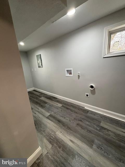 laundry area featuring washer hookup, dark hardwood / wood-style floors, and hookup for an electric dryer