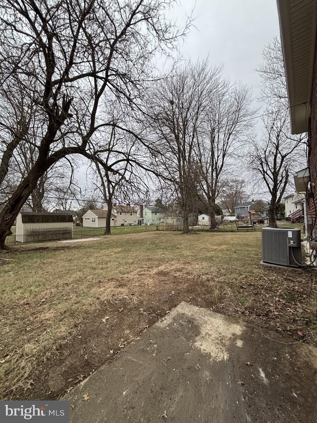 view of yard with central AC unit