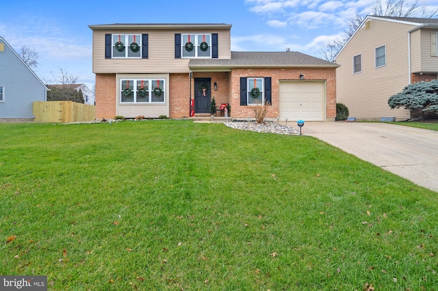 view of front property featuring a garage and a front lawn