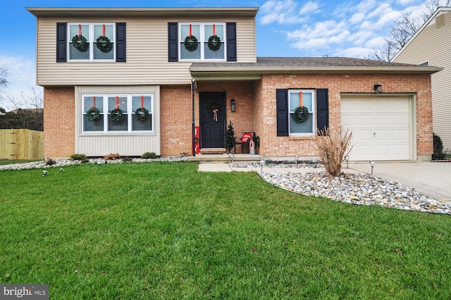 view of property featuring a front yard and a garage