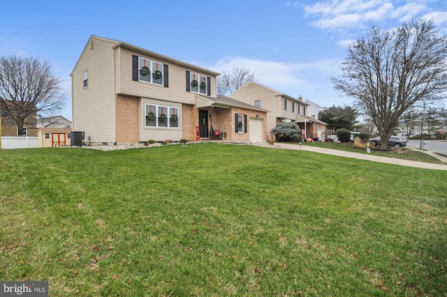 view of property featuring central AC, a front lawn, and a garage