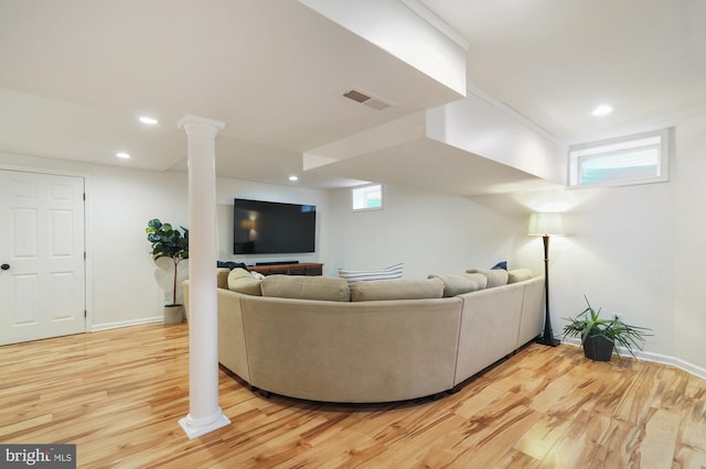 living room with hardwood / wood-style floors and a wealth of natural light