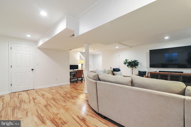 living room with hardwood / wood-style floors and ornamental molding