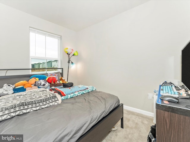 bedroom with light colored carpet