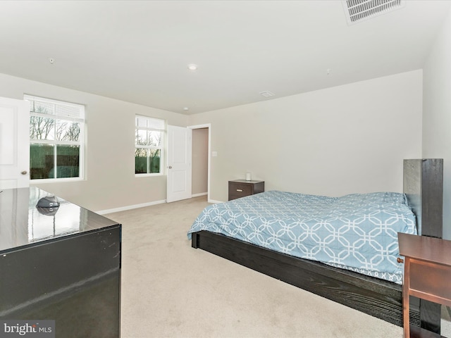 bedroom with light colored carpet