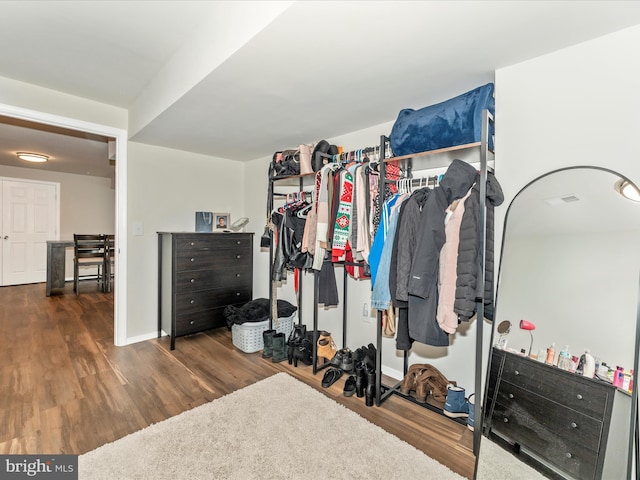 walk in closet featuring dark hardwood / wood-style flooring