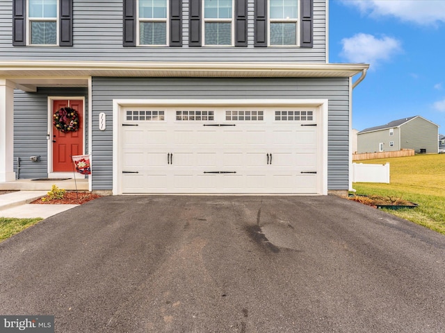 garage featuring a lawn