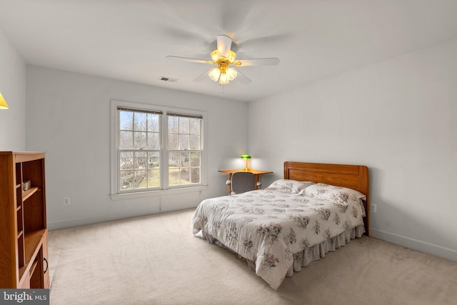 bedroom featuring a ceiling fan, carpet, visible vents, and baseboards