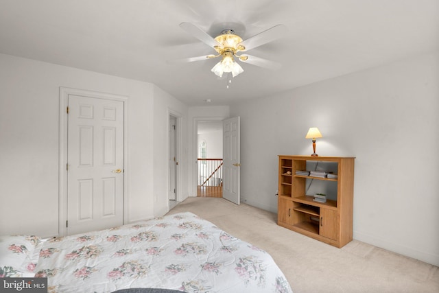 bedroom with carpet, baseboards, and ceiling fan