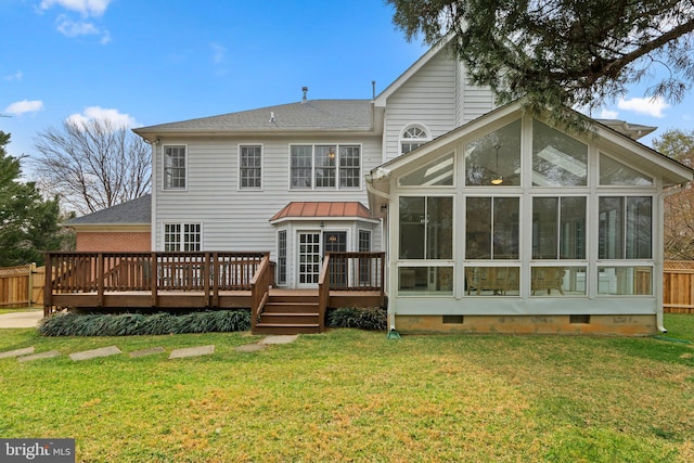 rear view of property with a sunroom, crawl space, a yard, fence, and a wooden deck