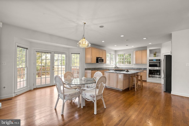 dining space featuring recessed lighting, visible vents, baseboards, and wood finished floors