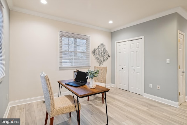 office area with crown molding and light hardwood / wood-style flooring