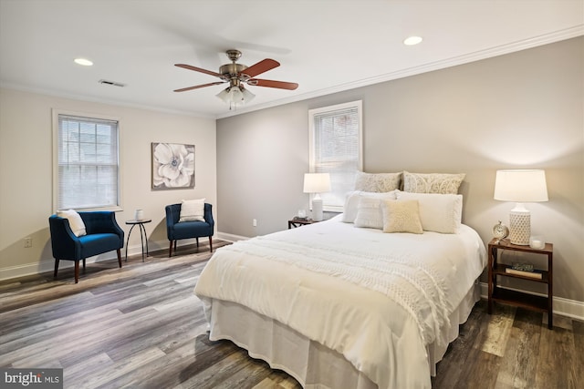 bedroom featuring ceiling fan, crown molding, and hardwood / wood-style flooring